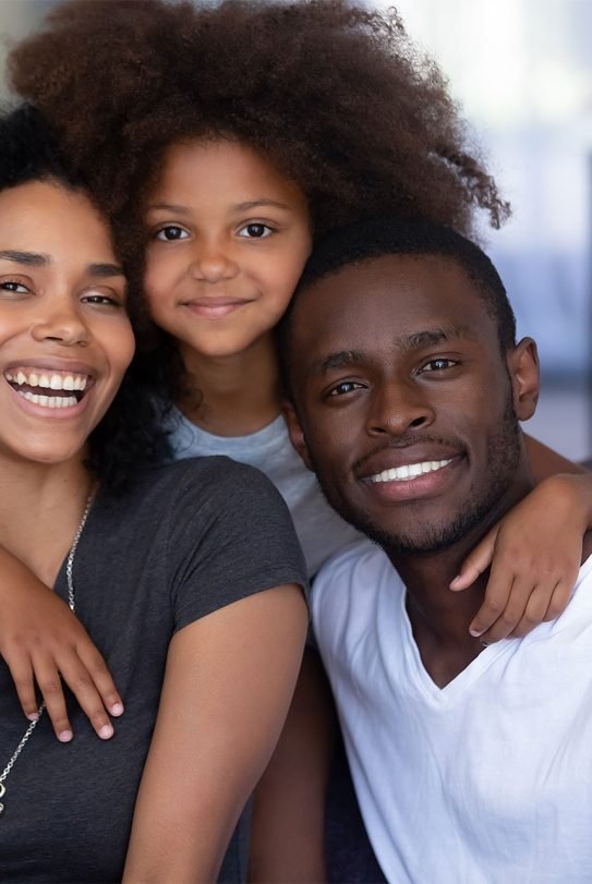 daughter-embracing-young-loving-black-parents